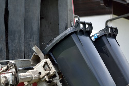 Workers managing waste clearance on a construction site