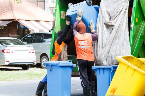 Clearance process in action with team members sorting household items