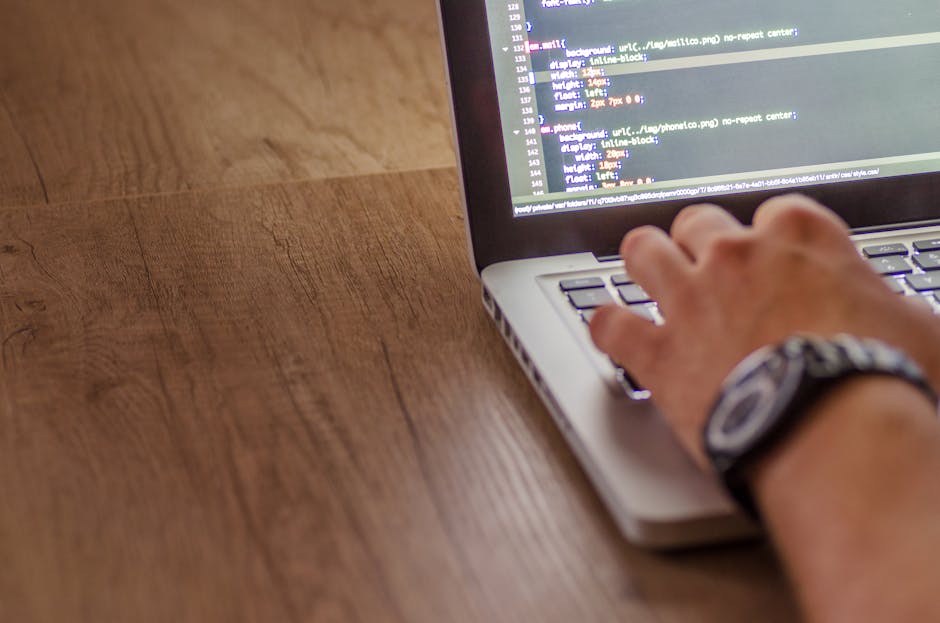 The image displays a close-up view of a computer screen showing lines of code in a text editor. The code is written in HTML, with various tags and attributes visible, including headings, links to imag